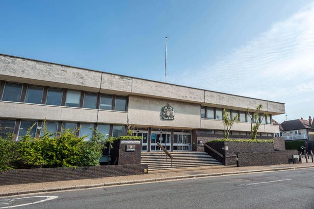 Police officer Mike Sinden denied a sexual assault charge as his trial began at Hove Crown Court (Alamy/PA)