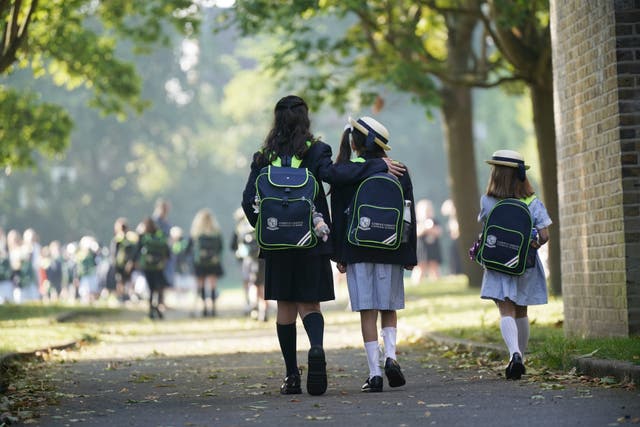 Pupils from Corpus Christi Catholic School, Brixton arrive at St Martin’s in the Field Girls’ School in London, as they are relocated after their school was affected with sub standard reinforced autoclaved aerated concrete (PA)