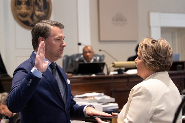 <p>A witness is sworn in by Colleton County Clerk of Court Rebecca ‘Becky’ Hill at Alex Murdaugh’s murder trial in March </p>