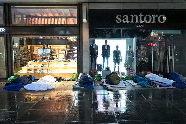 <p>Rough sleepers lay in their makeshift beds outside closed shops on Oxford Street, in the early hours of the morning in London on August 2, 2023</p>