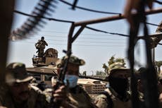 US-backed Kurdish forces impose curfew in eastern Syria after new clashes with rival Arab militia