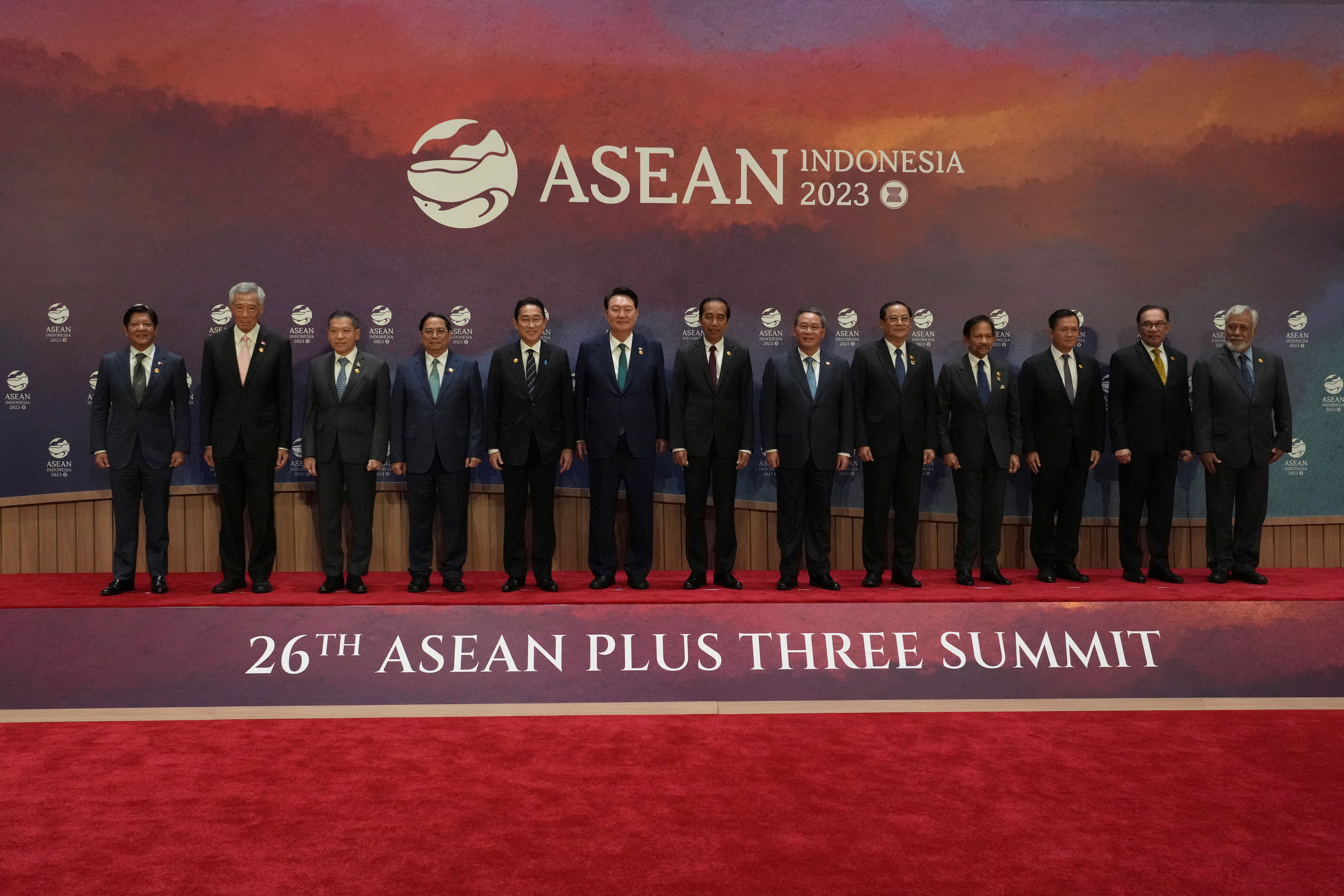 From left to right, Philippines president Ferdinand Marcos Jr, Singapore's prime minister Lee Hsien Loong, Thailand's permanent secretary of the ministry of foreign affairs Sarun Charoensuwan, Vietnam's prime minister Pham Minh Chinh, Japan's prime Mmnster Fumio Kishida, South Korean president Yoon Suk Yeol, Indonesian president Joko Widodo, Chinese premier Li Qiang, Laos' prime minister Sonexay Siphandone, Brunei's sultan Hassanal Bolkiah, Cambodia's prime minister Hun Manet, Malaysian prime minister Anwar Ibrahim and East Timor's prime minister Xanana Gusmao pose for a family photo