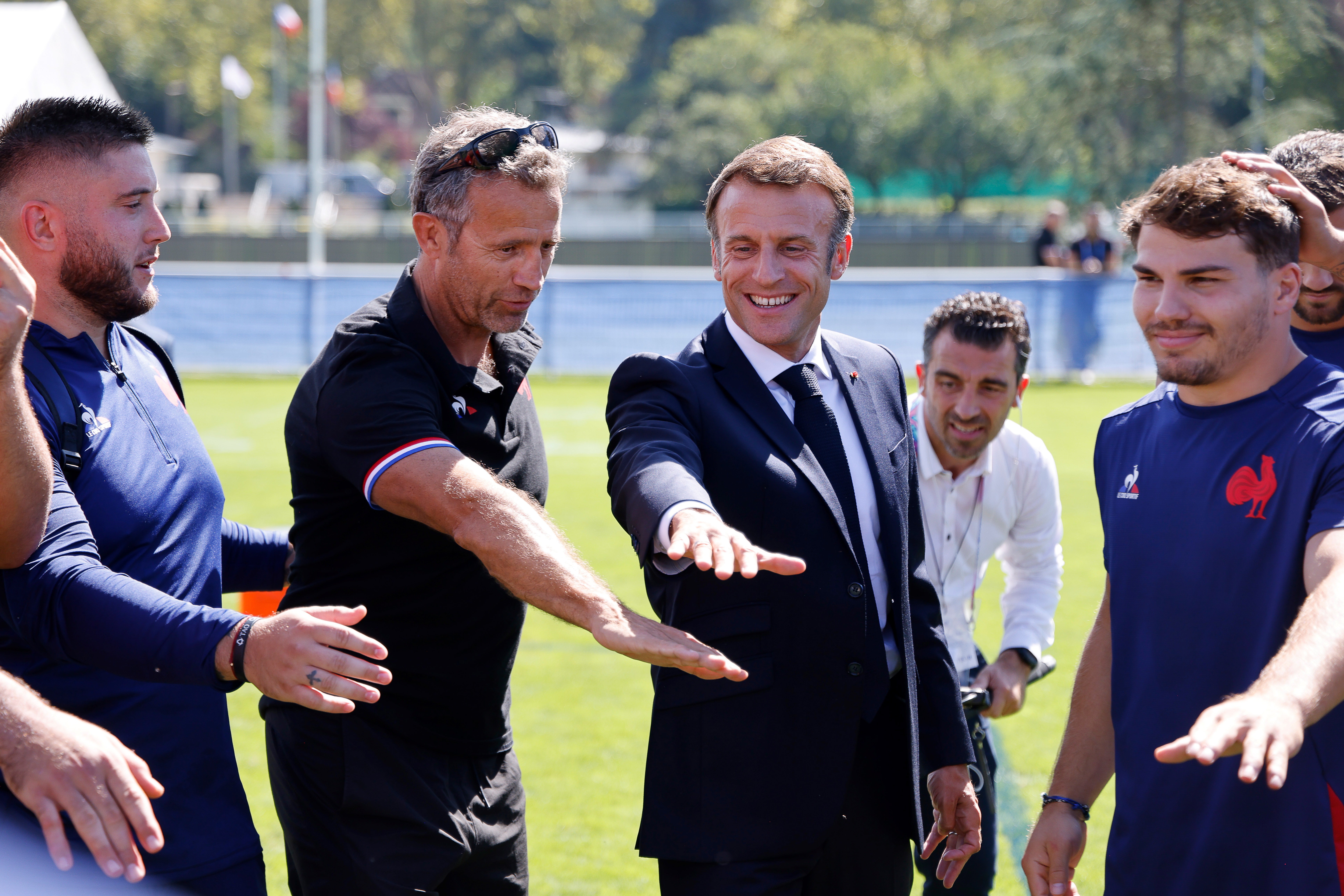 Nerves? What nerves?: President Emmanuel Macron with French coach Fabien Galthie (second left) and captain Antoine Dupont (right) during training earlier this week