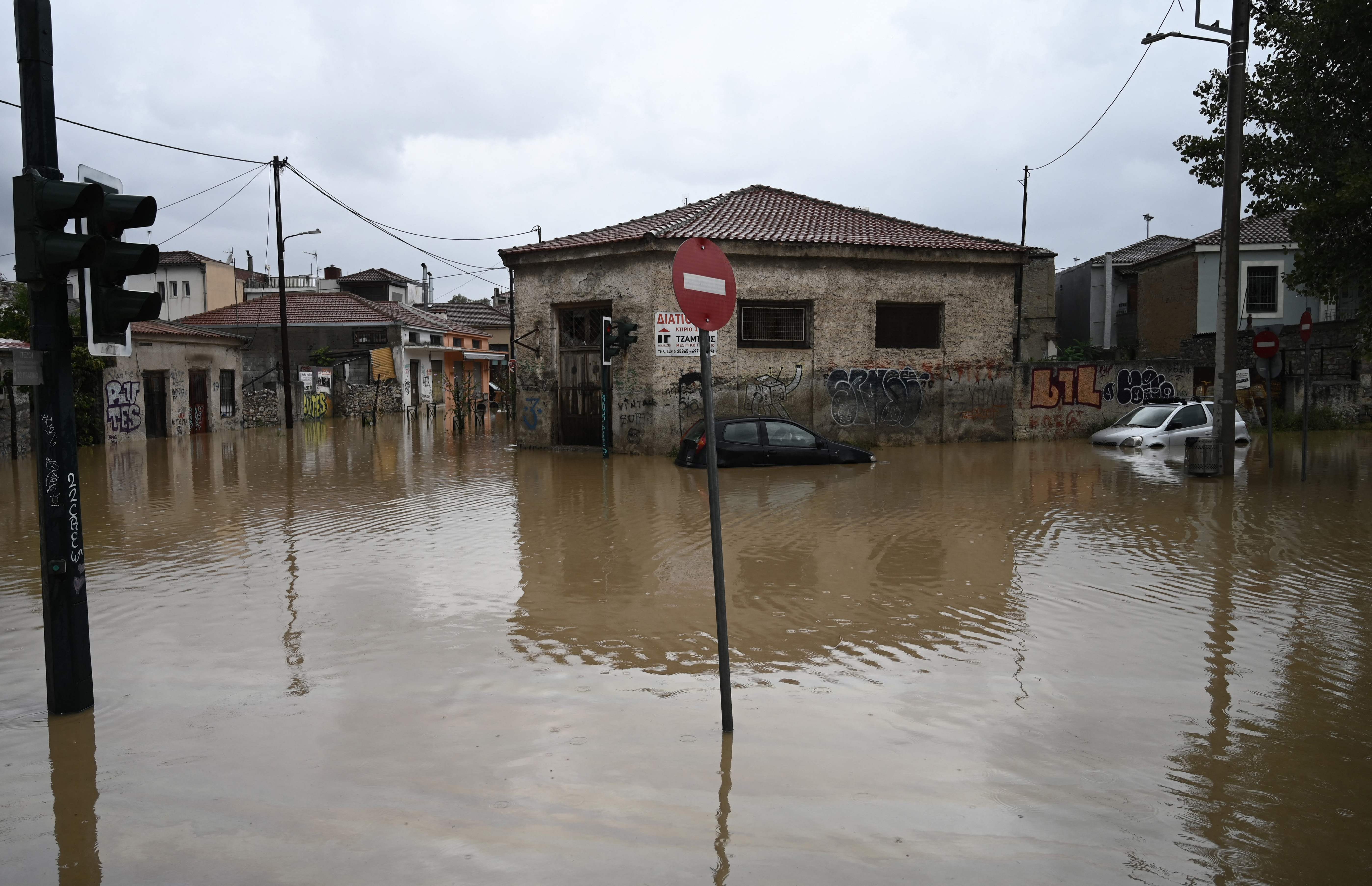 Cars in a flooded road in the city of Volos, central Greece