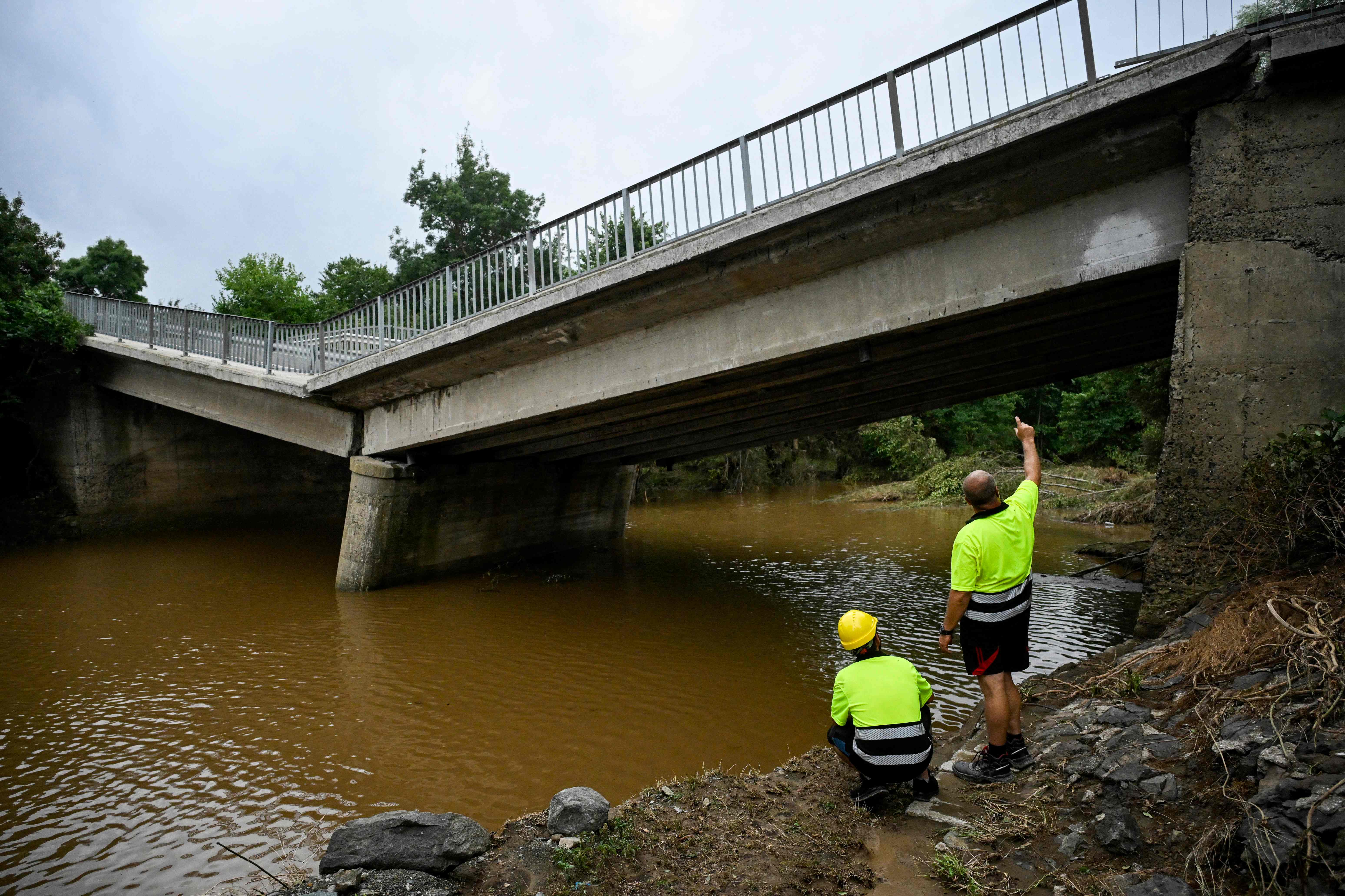 Engineers inspect a damaged bridge, which connects the city of Burgas and the Turkish border