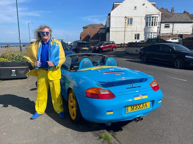 <p>Geoff Dunn and his blue and yellow Porsche</p>