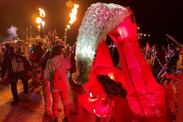Attendees gather during the annual Burning Man Festival on September 4, 2023. Thousands of revelers stuck in the mud for days at the Burning Man festival in the US state of Nevada were told they could finally trek home on September 4, 2023