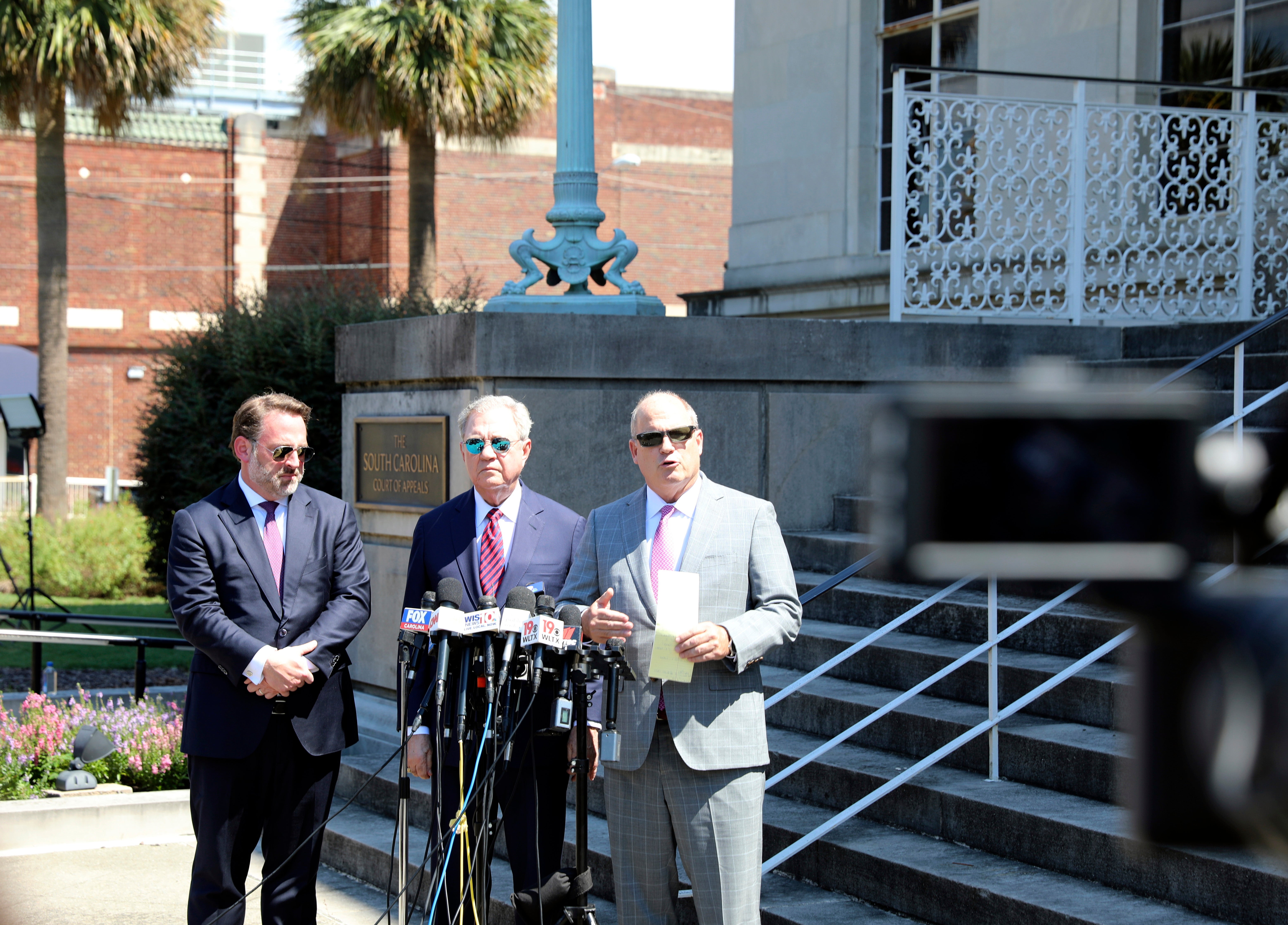 Alex Murdaugh's attorneys Phillip Barber, from left, Dick Harpootlian and Jim Griffin speak at a news conference after filing an appeal of Murdaugh's double murder conviction on 5 September