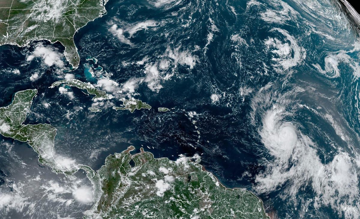 Tropical Storm Lee strengthens into a hurricane as it churns across Atlantic toward Caribbean Tropical Storm Lee strengthens into a hurricane as it churns across Atlantic toward Caribbean