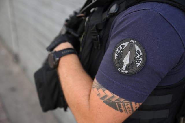 <p>Representational image of a French police officer of the CRS 8 unit patrolling in Nimes, southern France on 22 August 2023</p>