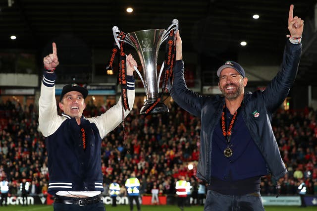 <p>Rob McElhenney and Ryan Reynolds celebrate Wrexham AFC’s promotion in April 2023</p>