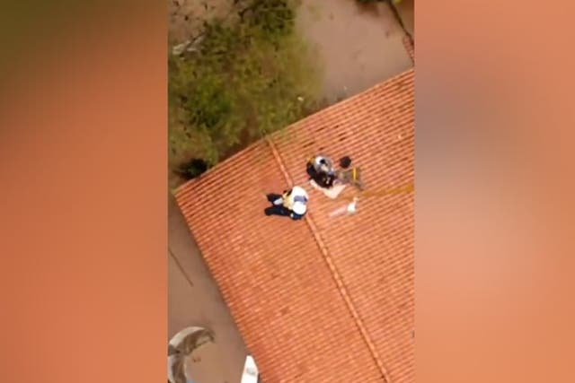 <p>Toddler rescued from roof of flooded home in Brazil.</p>