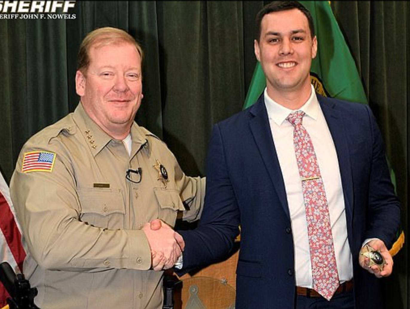 Spokane County Sheriff John Nowels, left, with deputy Brittan Morgan