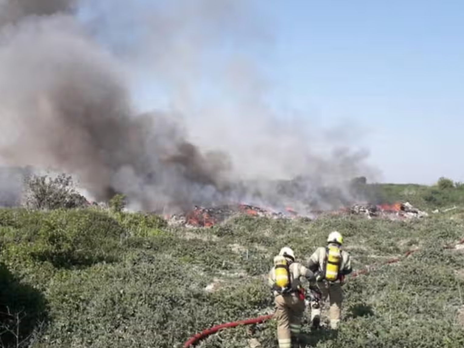 Firefighters in 2020 tackling the same fire in Rainham