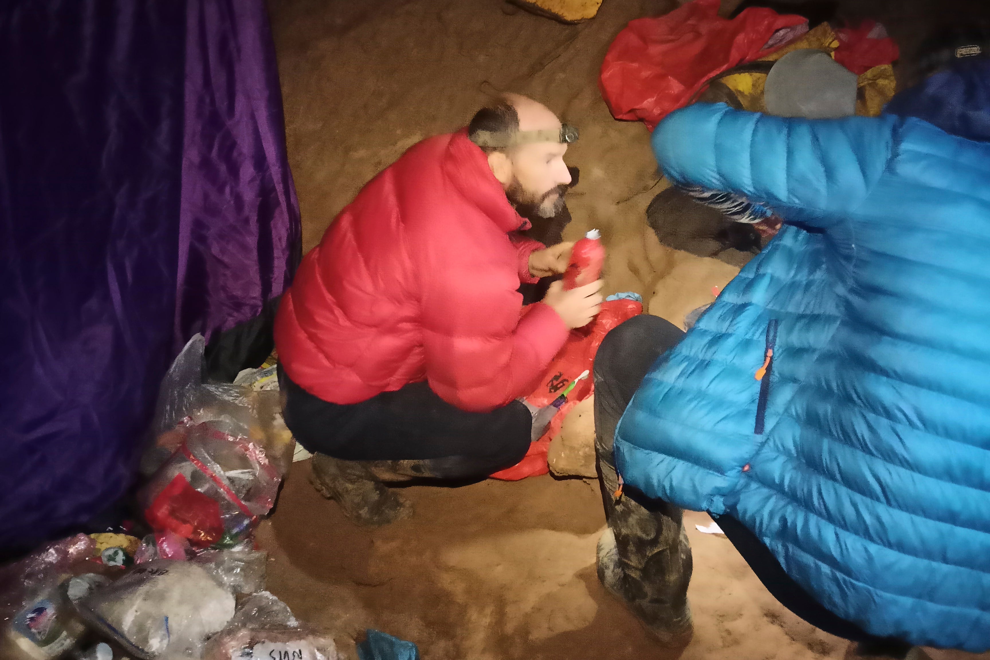 American caver Mark Dickey, left, 40, talks to a colleague inside the Morca cave near Anamur, southern Turkey, Thursday, Sept. 7, 2023.