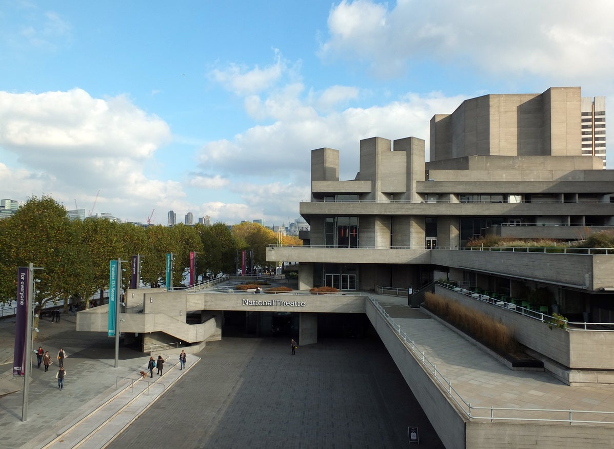People walking along the concourse of the Royal National Theatre in London