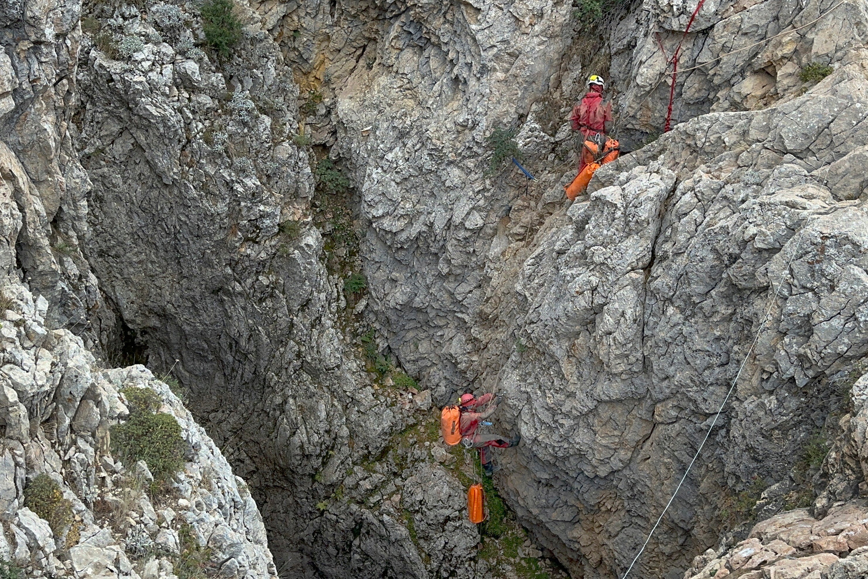 European Cave Rescue Association (ECRA) members work next to the entrance of Morca cave near Anamur, southern Turkey, Thursday, Sept. 7, 2023.