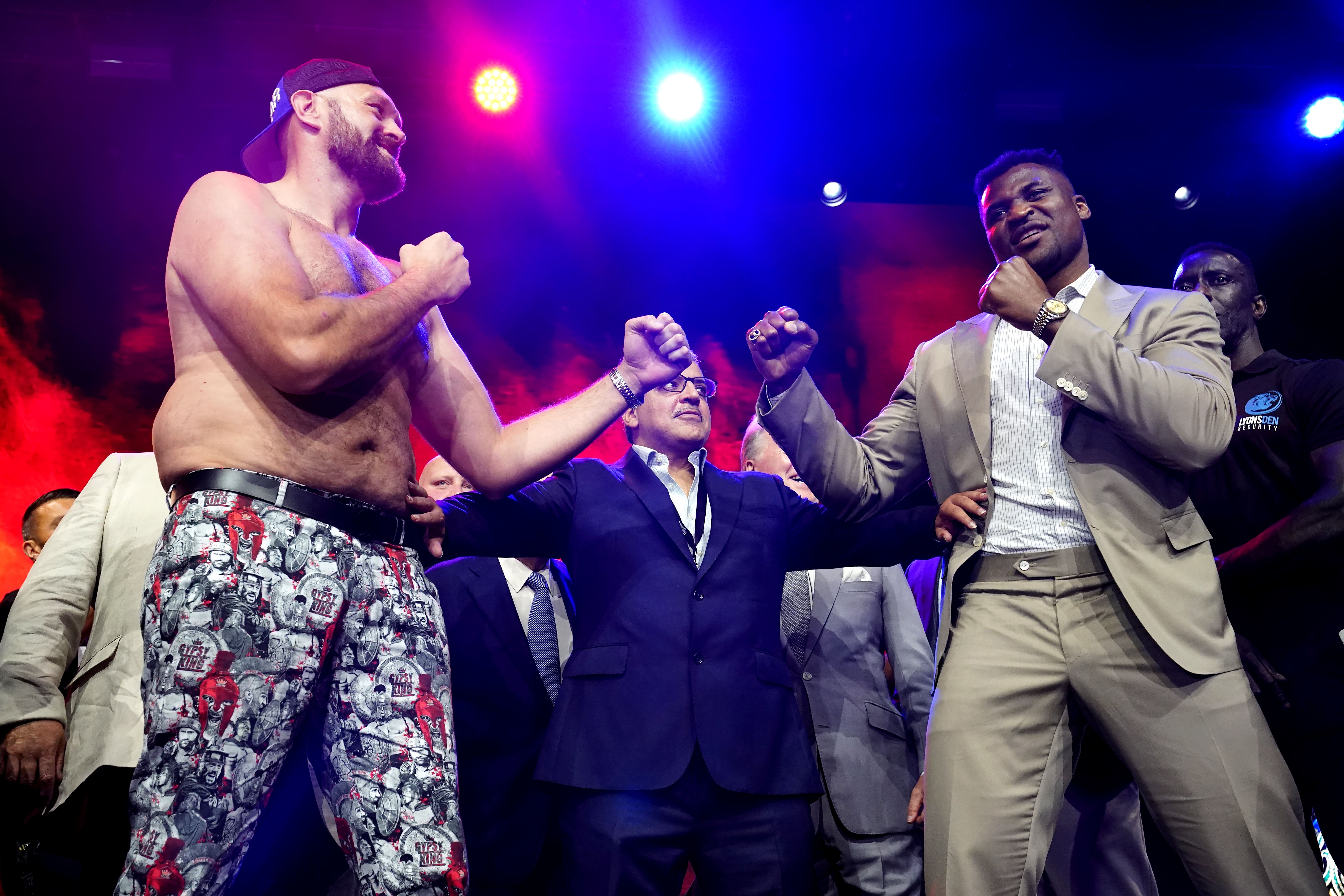 Tyson Fury, left, and Francis Ngannou face off in London (James Manning/PA)