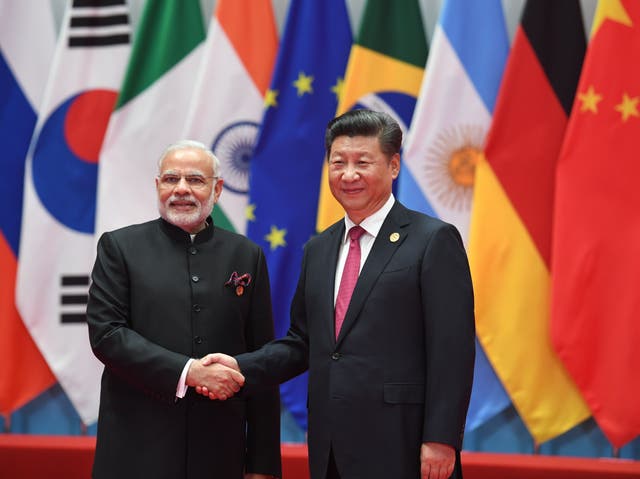 <p>India’s prime minister Narendra Modi shakes hands with China’s president Xi Jinping (R) before the G20 leaders’ family photo in Hangzhou in 2016</p>