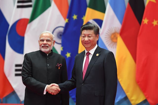 <p>India’s prime minister Narendra Modi shakes hands with China’s president Xi Jinping (R) before the G20 leaders’ family photo in Hangzhou in 2016</p>
