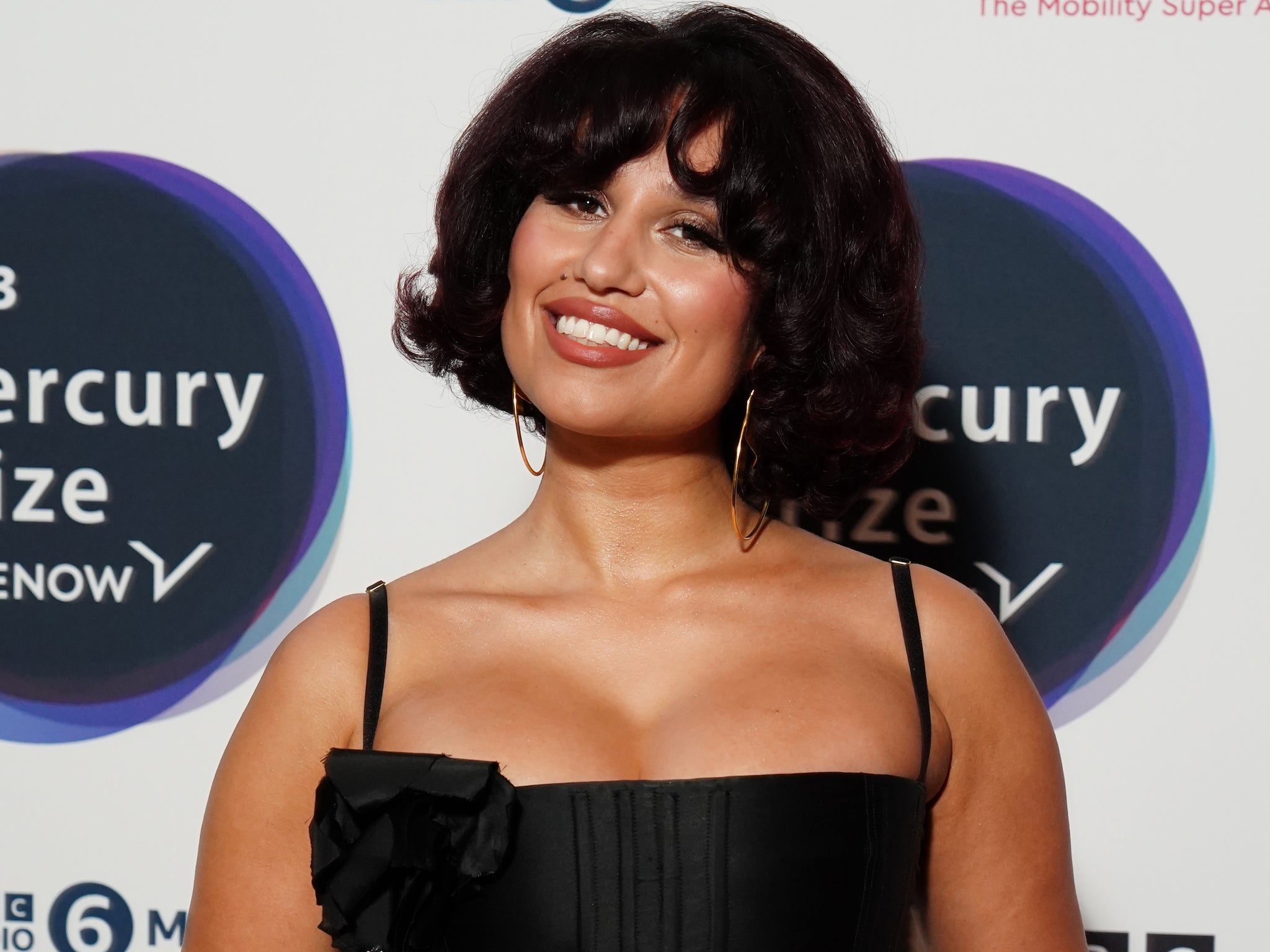 Fellow first-time nominee RAYE was seen grinning in the audience as Ezra Collective accepted their award