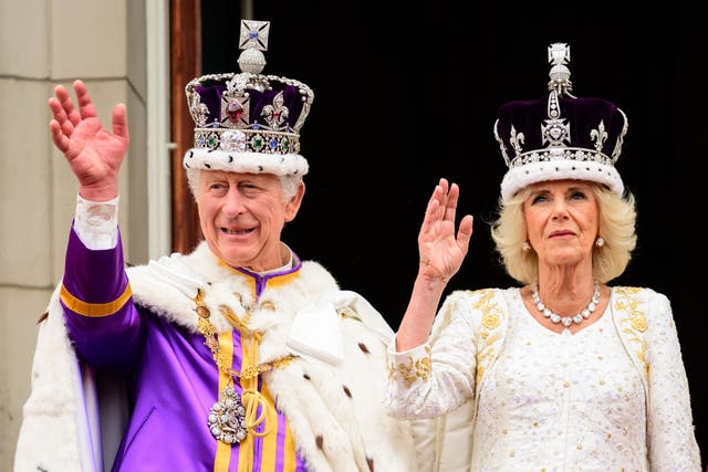 The King and Queen on the balcony on their coronation day (Leon Neal/PA)
