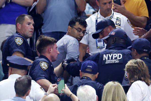 <p>A demonstrator is removed from the Arthur Ashe Stadium by New York City Police</p>