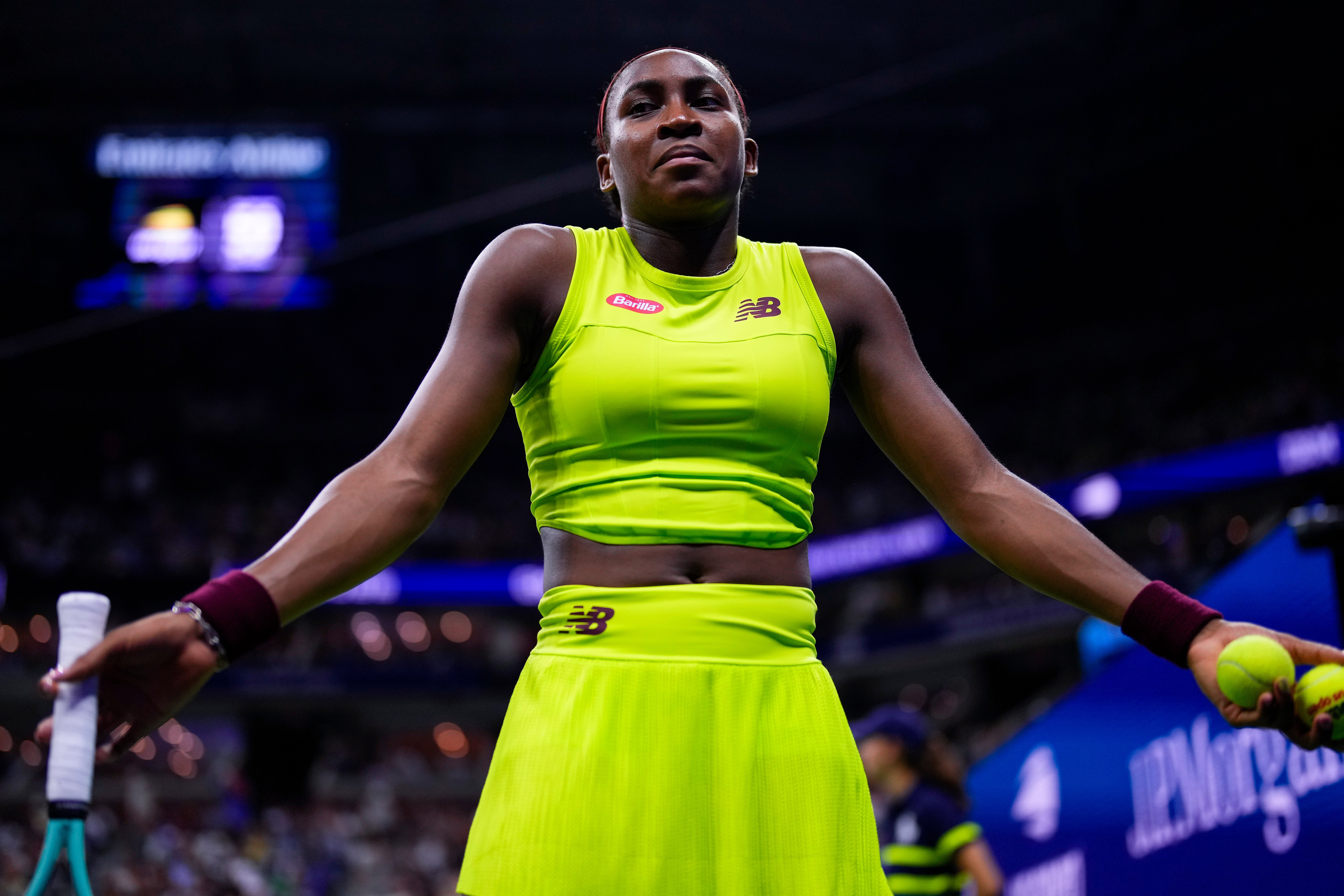 Coco Gauff reacts as protesters disrupt her match against Karolina Muchova of the Czech Republic