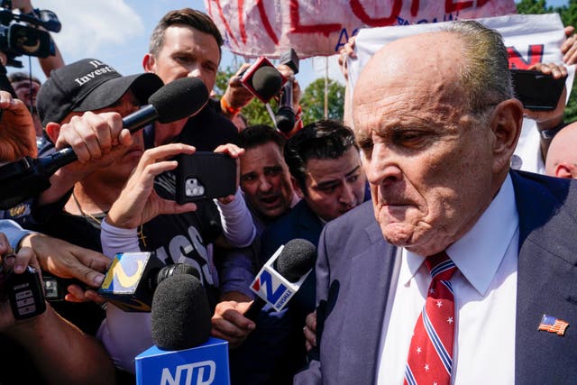 <p>Rudy Giuliani speaks outside the Fulton County jail on 23 August 2023 in Atlanta</p>
