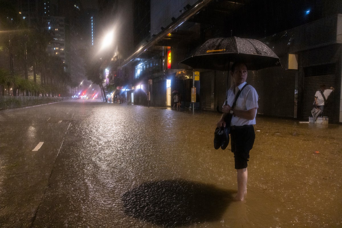 Hong Kong closes schools as torrential rain floods streets, subway station