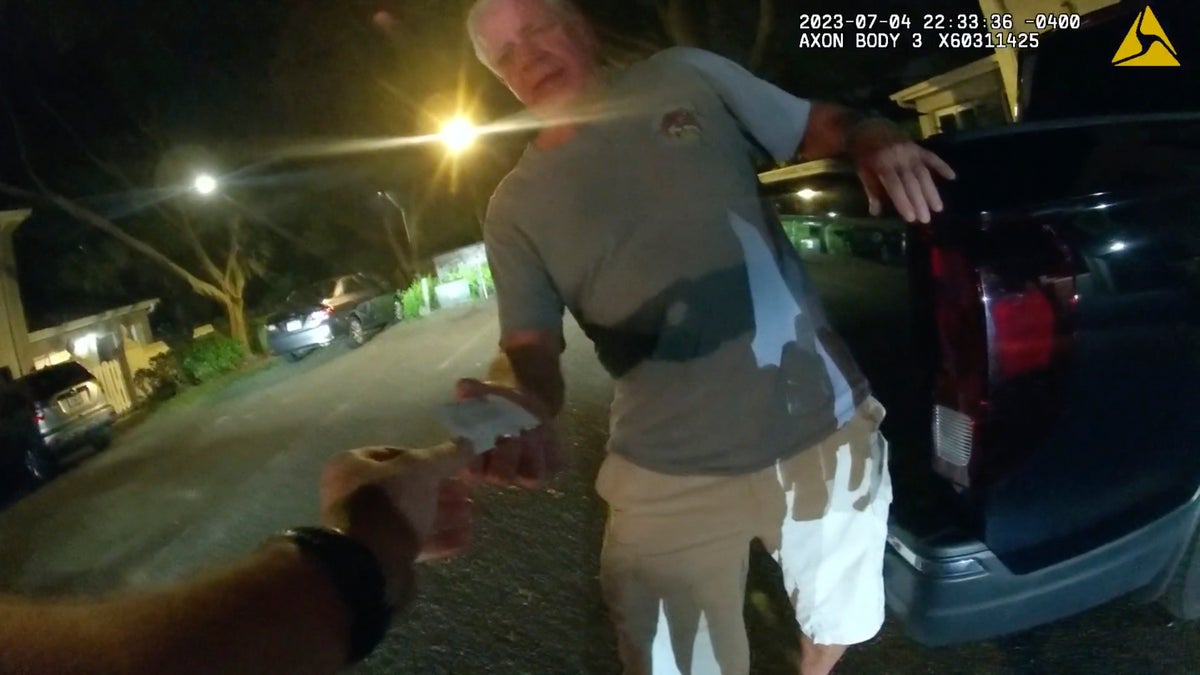 Prosecutor allegedly caught on video sliding business card to police investigating a DUI hit-and-run