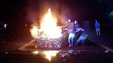 Driver pulled out of burning car moments before it blows up