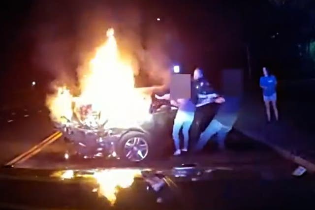 <p>Driver pulled out of burning car moments before it blows up.</p>