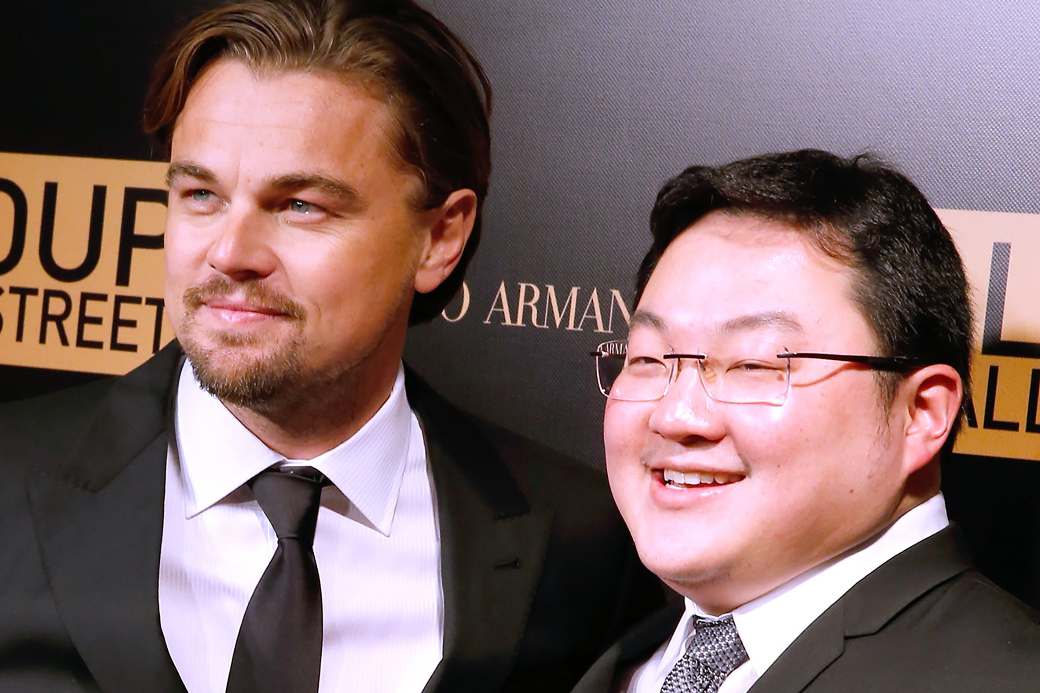International man of mystery: Jho Low poses with Leonardo DiCaprio at the French premiere of ‘The Wolf of Wall Street’ in 2013