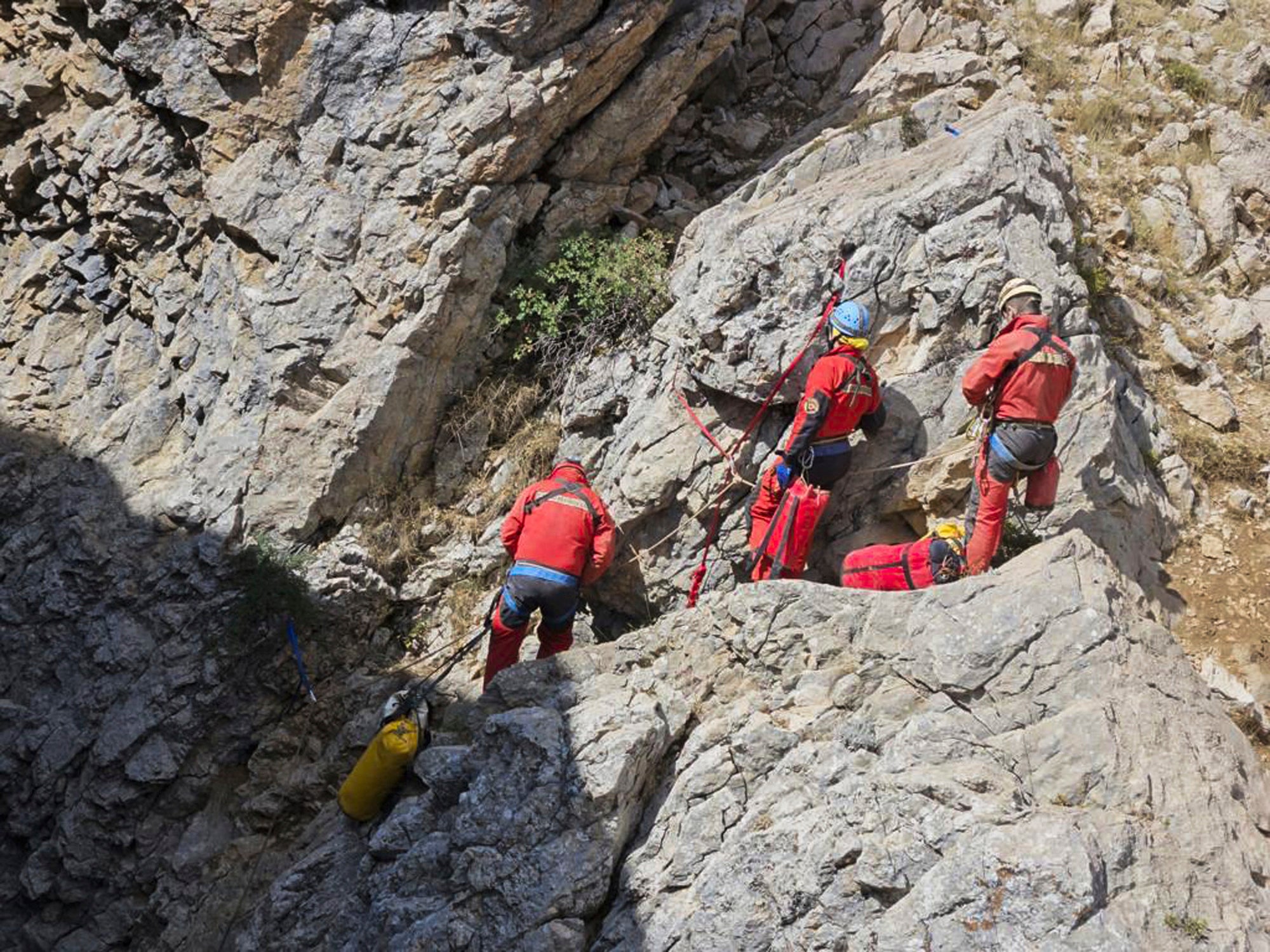 European Cave Rescue Association (ECRA) members work next to the entrance of Morca cave near Anamur, southern Turkey, Thursday, Sept. 7, 2023.