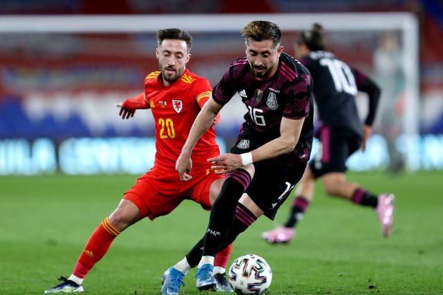 Josh Sheehan (left) is back in the red jersey of Wales after two years away from international football (David Davies/PA)