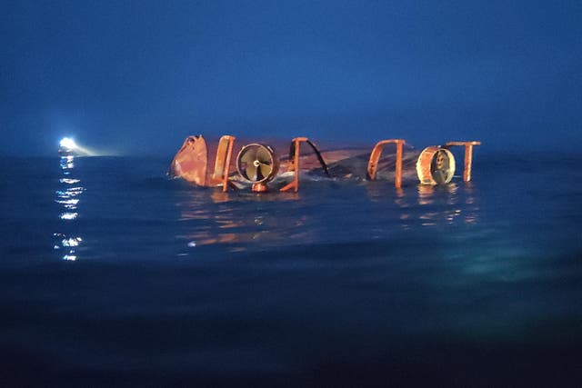 The Karin Hoj capsized following the collision and two crew members died (MAIB/PA)