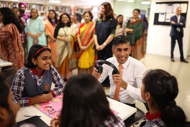 <p>Sunak meets local schoolchildren at the British Council in Delhi on the first day of his visit for the G20 summit</p>