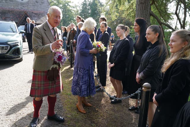 The King and Queen meet estate staff and members of the public as they leave Crathie Parish Church (Andrew Milligan/PA)