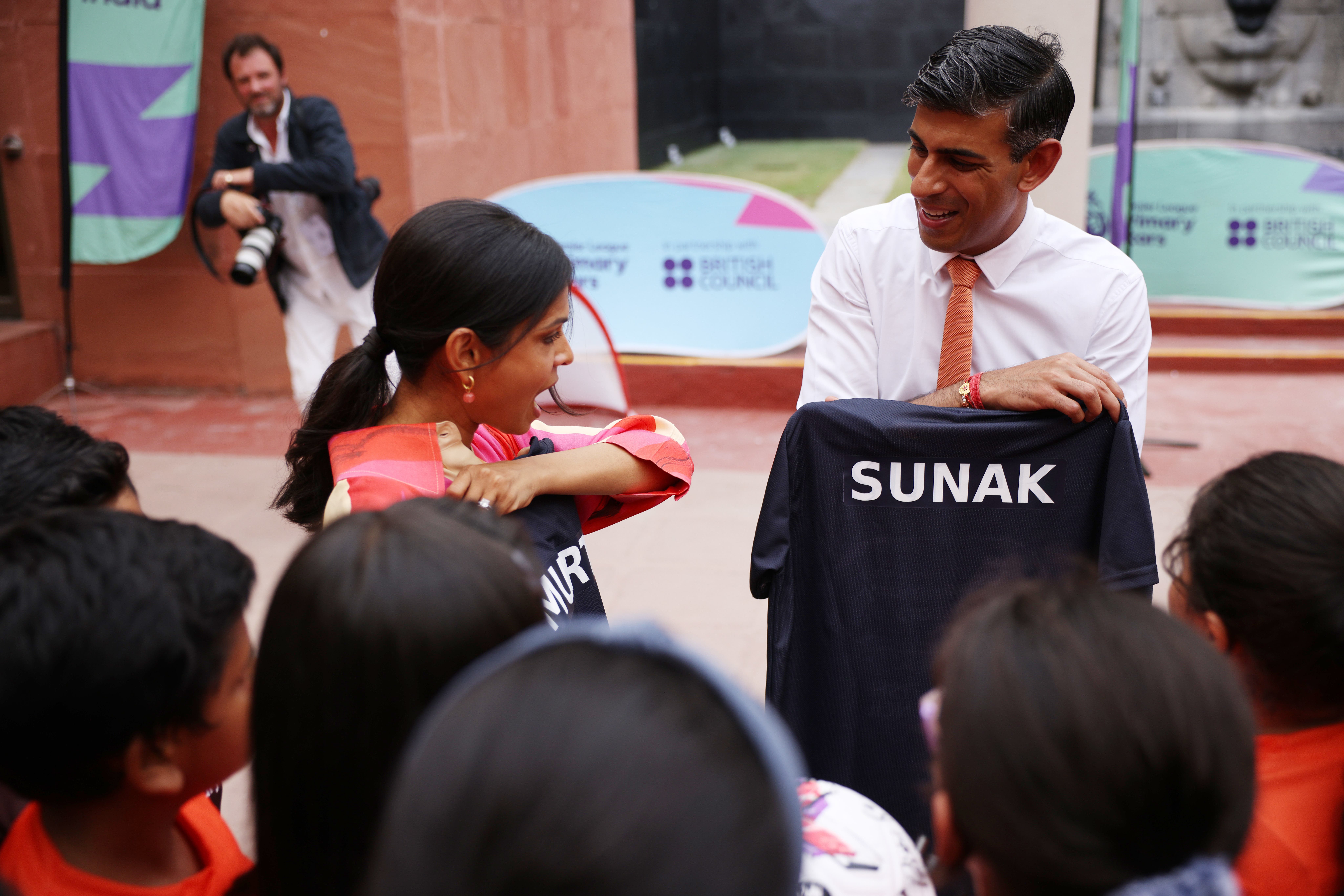 Prime Minister Rishi Sunak and his wife Akshata Murty meet local schoolchildren at the British Council during an official visit ahead of the G20 Summit in New Delhi, India (Dan Kitwood/PA)
