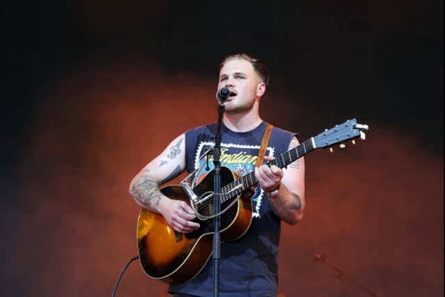 <p>Zach Bryan performs onstage during Day 2 of the 2022 Stagecoach Festival</p>