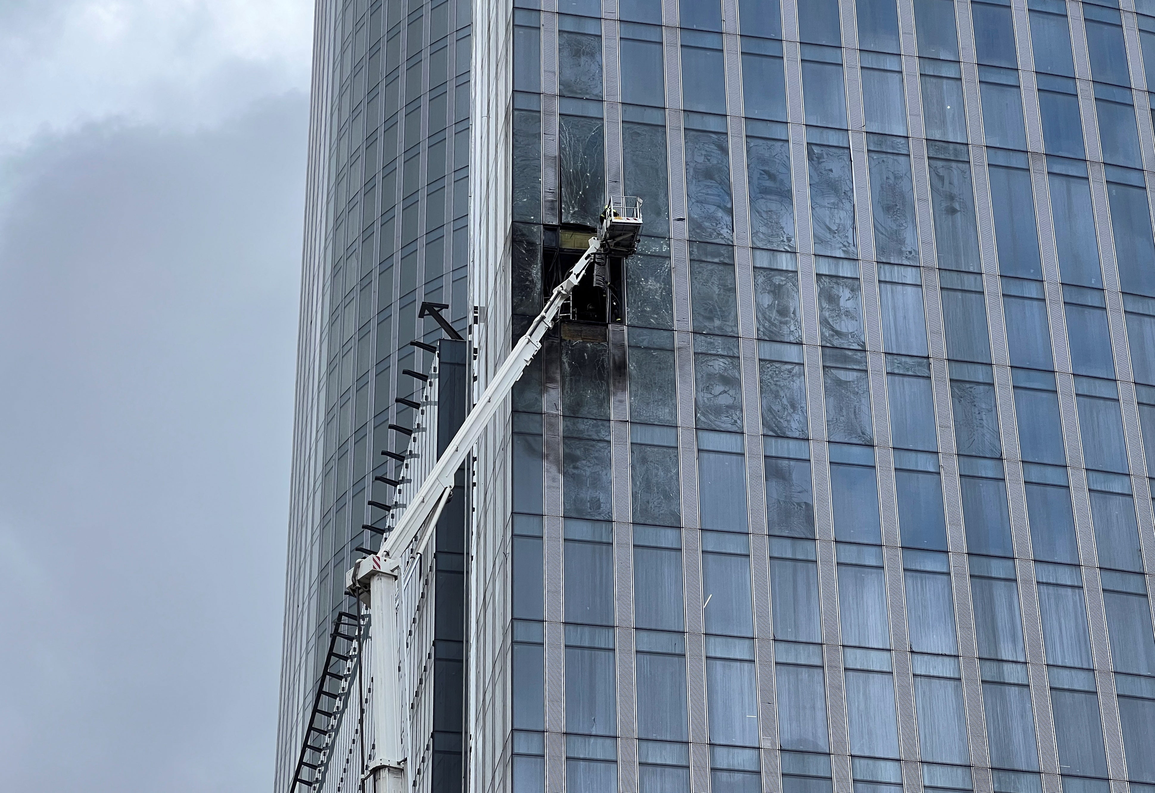 A view shows the damaged facade of a high-rise building in the Moscow City following an alleged Ukrainian drone attack
