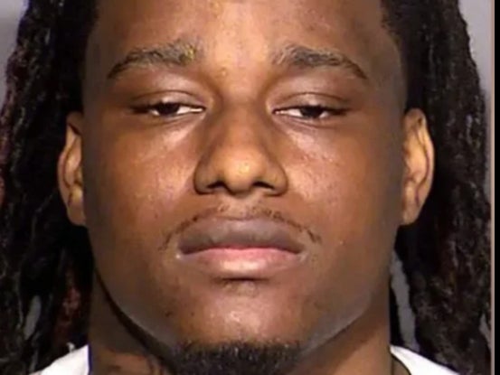Kenjuan McDaniel, a rapper from Las Vegas, was arrested and charged in the murder of Randall Wallace in September 2021