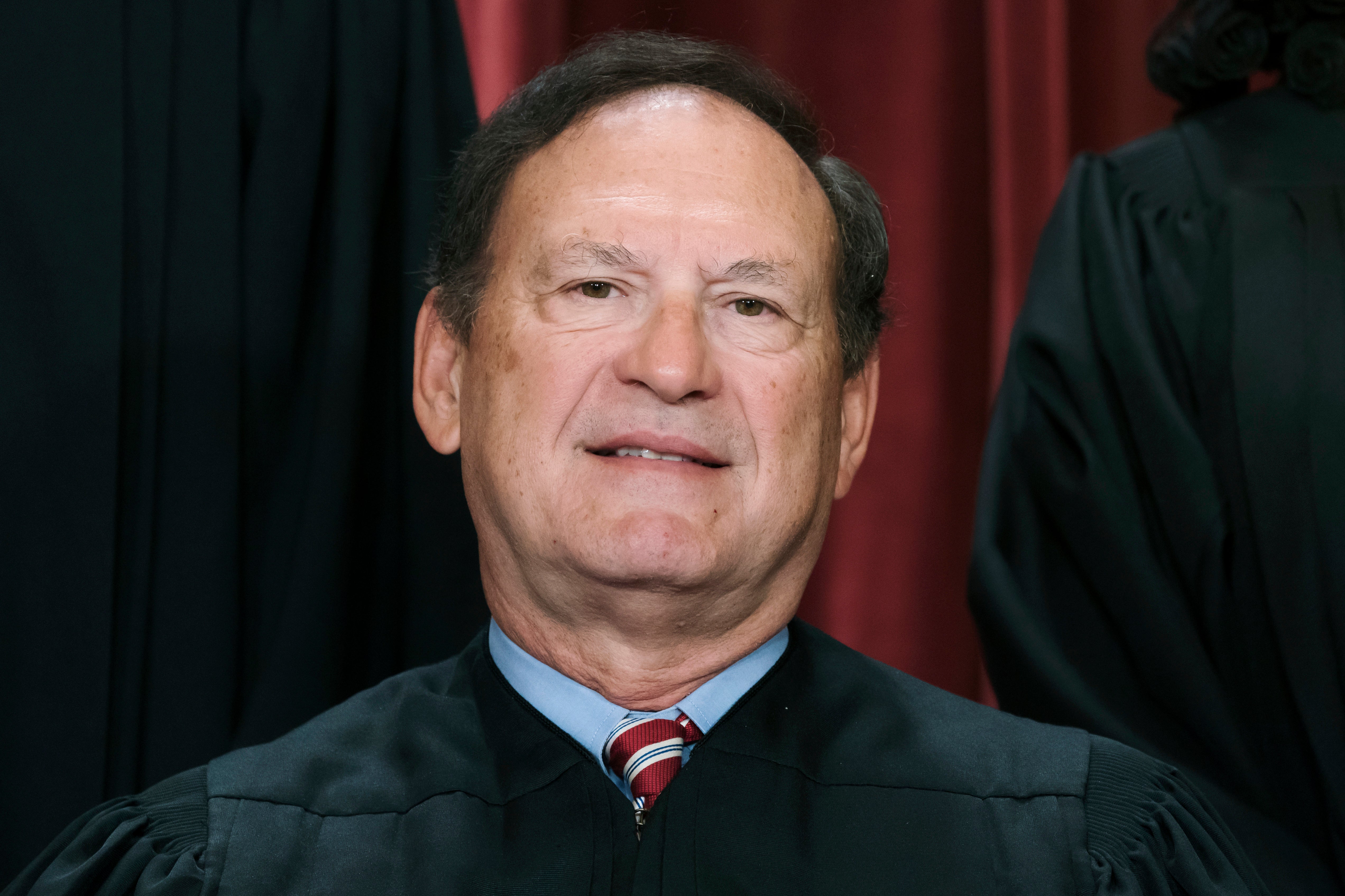 Supreme Court Justice Samuel Alito has come under fire over flags seen flying outside his homes in Virginia and New Jersey