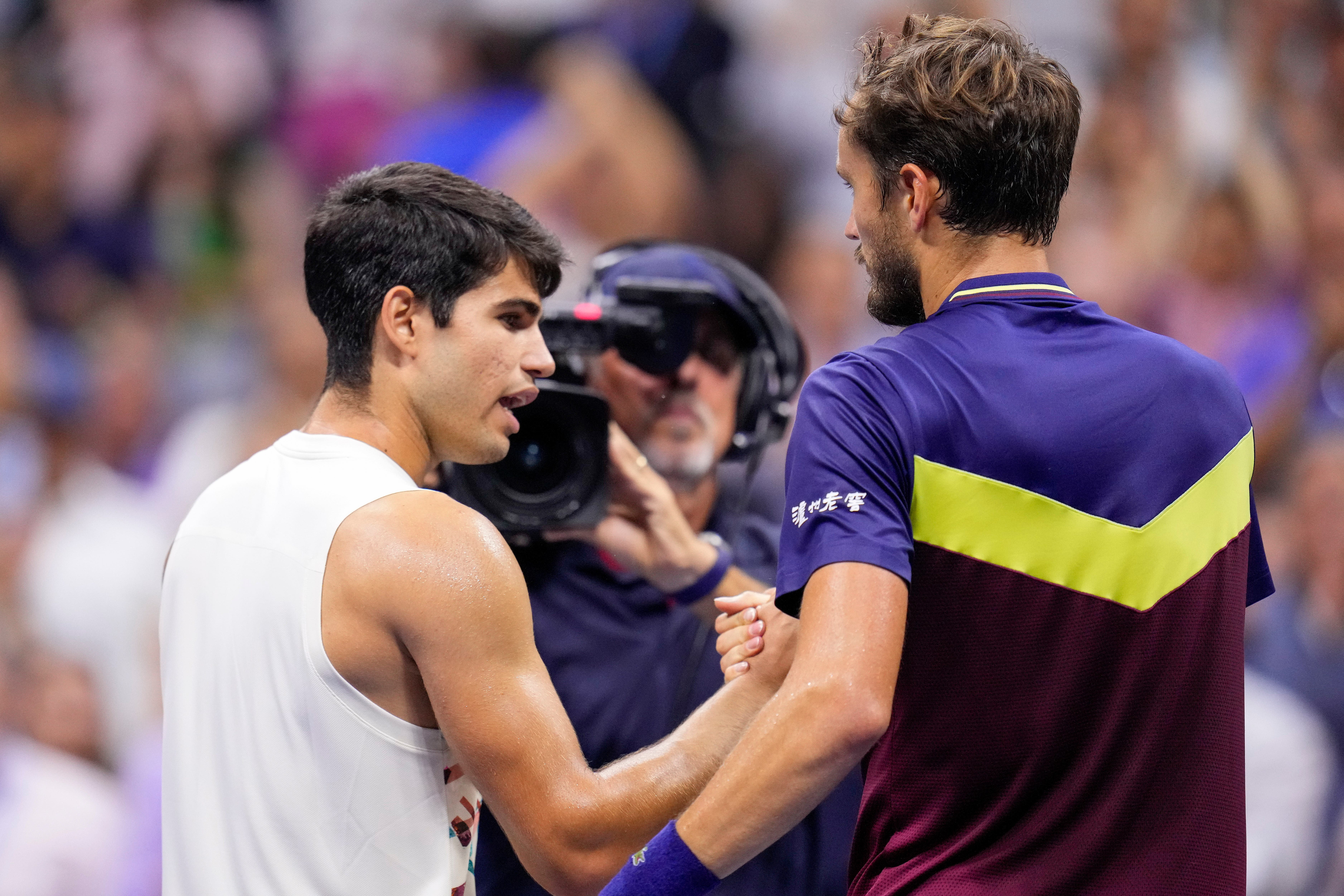 Carlos Alcaraz shakes hands with Daniil Medvedev (Manu Fernandez/AP)