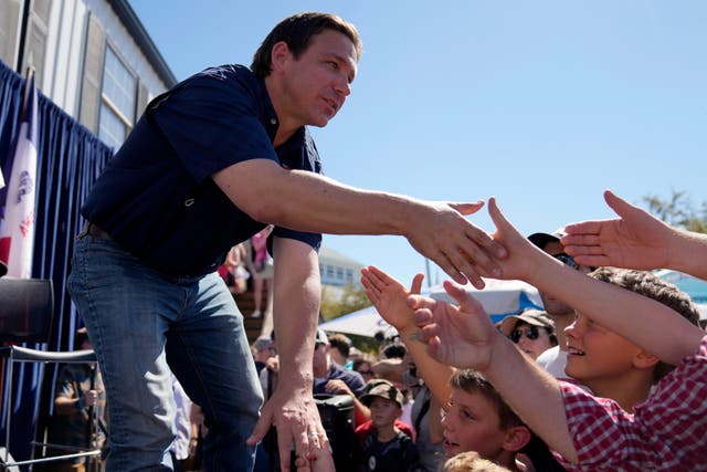 <p>Republican presidential candidate Florida Gov. Ron DeSantis shakes hands with fairgoers after taking part in a Fair-Side Chat with Iowa Gov. Kim Reynolds at the Iowa State Fair, Saturday, Aug. 12, 2023, in Des Moines, Iowa. </p>