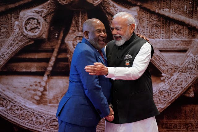 <p>Indian Prime Minister Narendra Modi, right, shares a light moment with African Union Chairman and President of the Union of the Comoros Azali Assoumani </p>