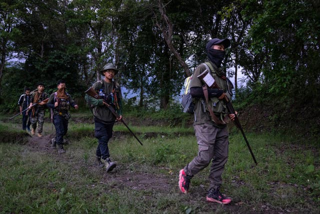 <p>File: Armed tribal Kuki community members patrol near a de facto front-line dissecting the area into two ethnic zones in Manipur </p>