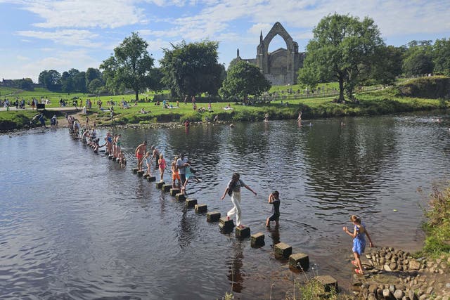 People have enjoyed the sunshine at Bolton Abbey in Yorkshire (PA)