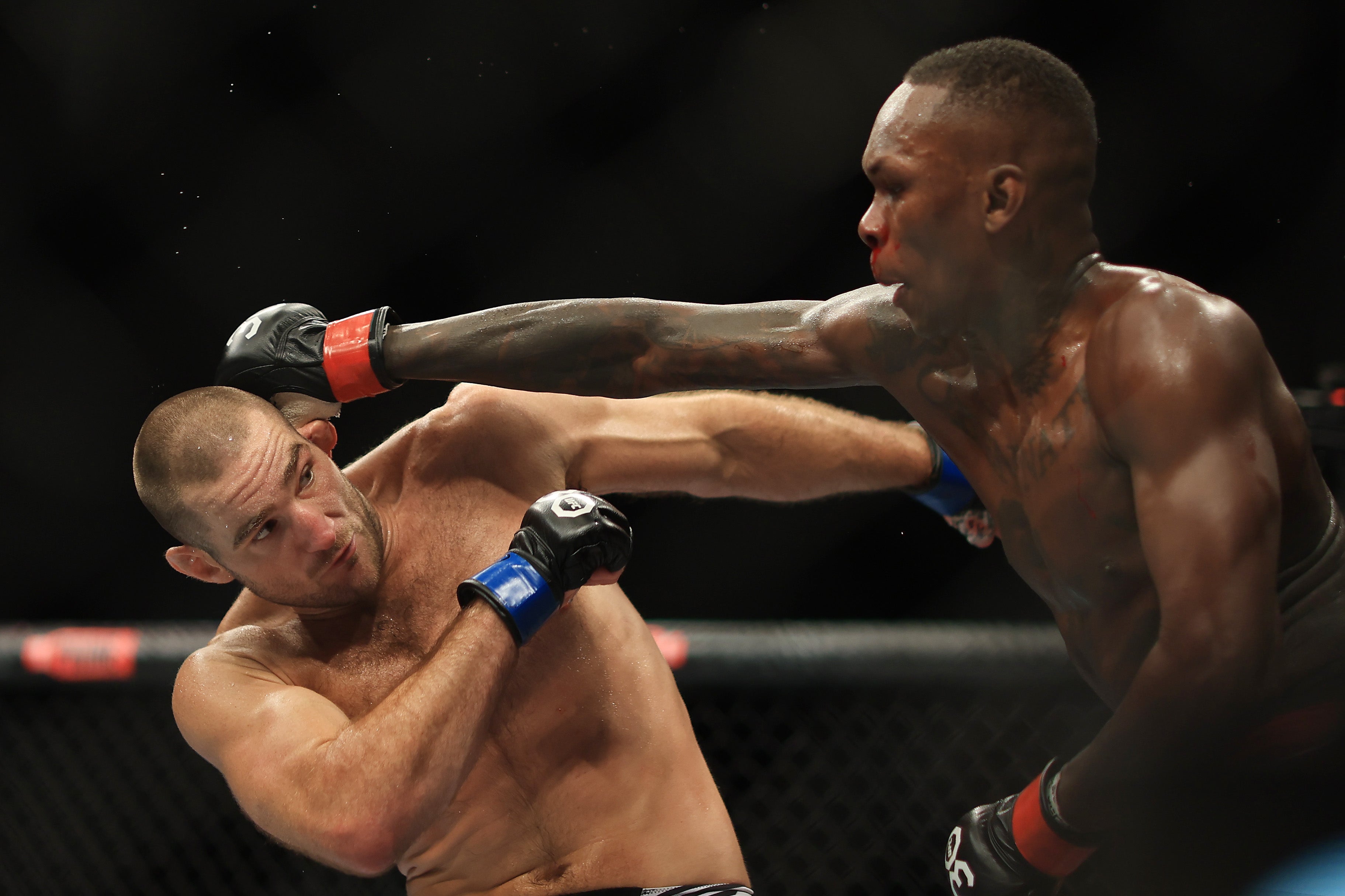 Israel Adesanya (right) lost the UFC middleweight title to Sean Strickland in his last fight